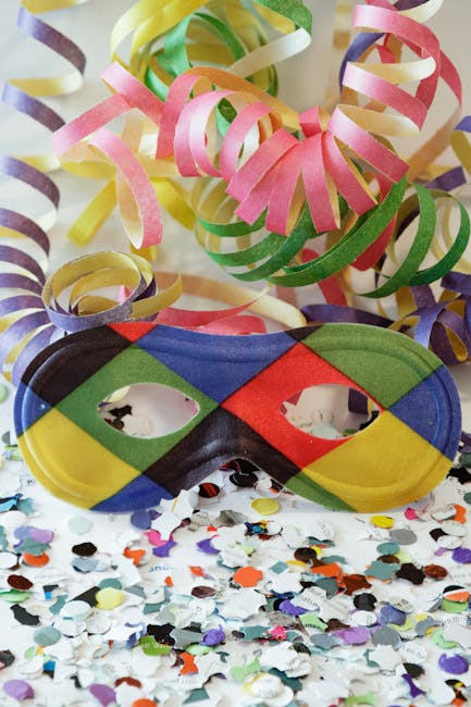 pexels-photo-15630505-15630505 Colorful carnival mask with ribbons and confetti for festive celebration decor.